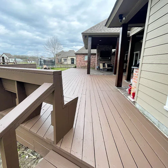 Freshly painted backyard deck and stairs on a Baton Rouge area home